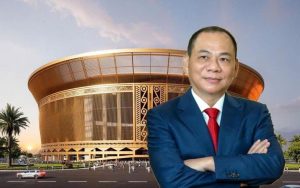 Phối cảnh sân vận động VinFast mái vòm màu vàng đồng, phía trước là chân dung tỷ phú Phạm Nhật Vượng